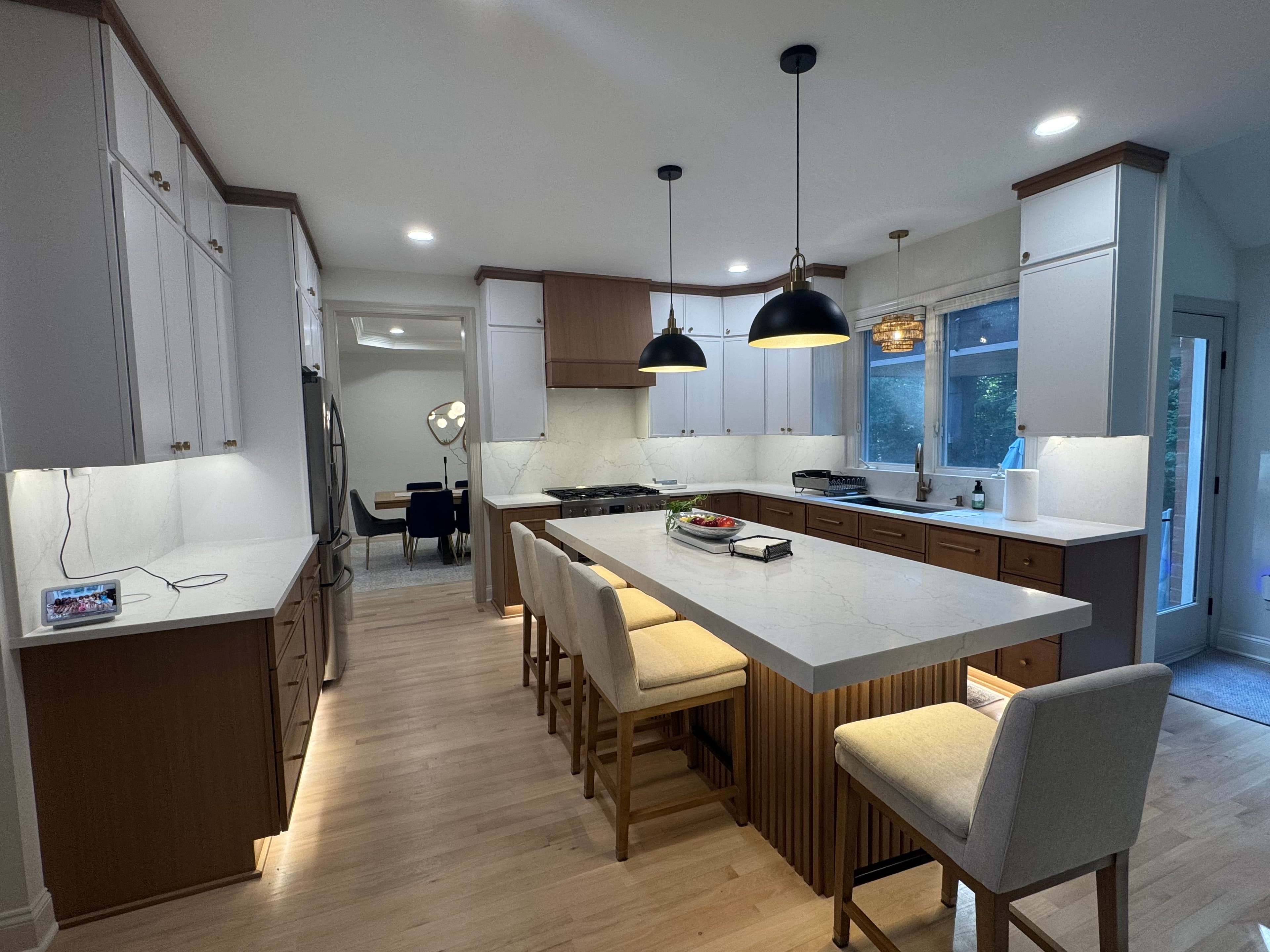 Two-tone Charlotte kitchen with waterfall island and custom cabinets.